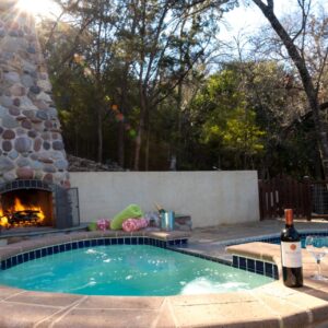 Hot tub and fireplace, with wine and wine glasses