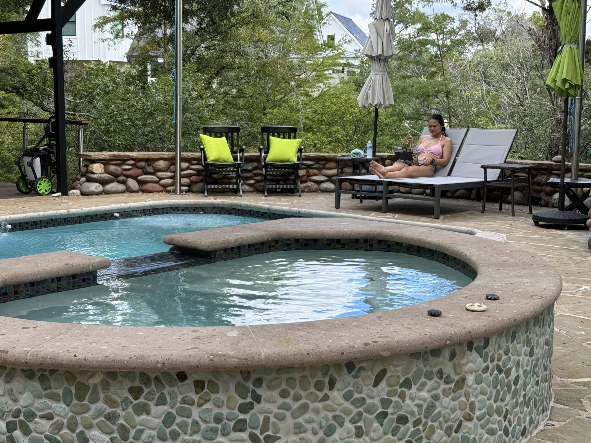 Pool & Hot Tub area w/ Pergola, Fireplace, and loungers