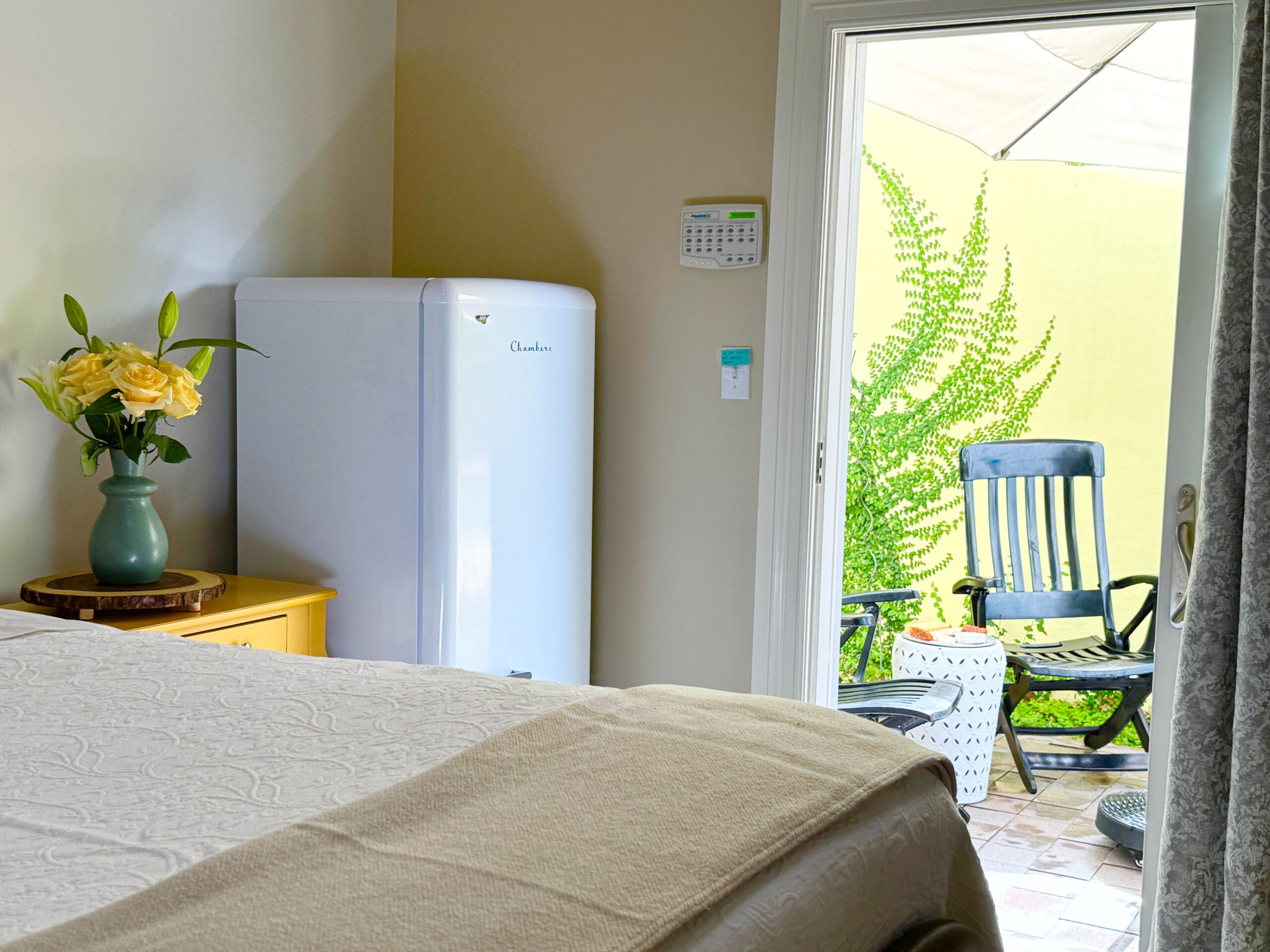 Door to Courtyard-fridge-table-flowers-