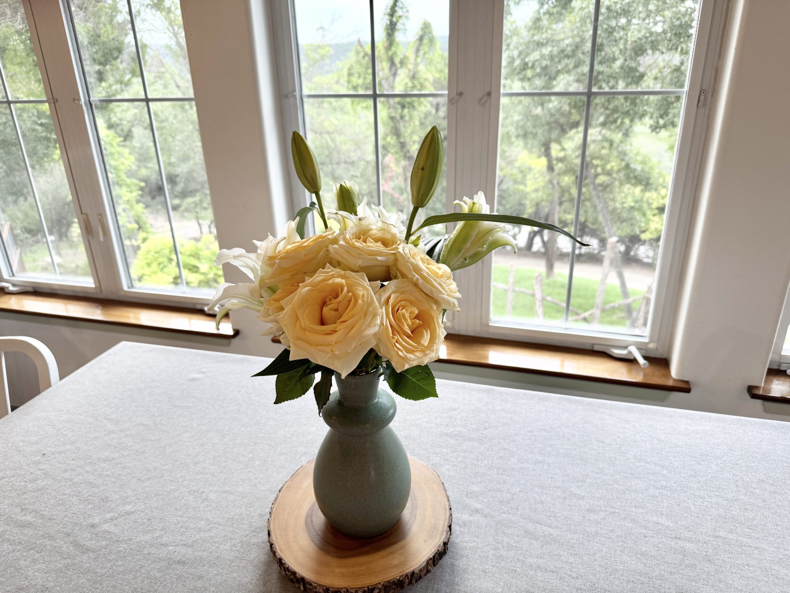 Flowers on table gsthse-view of yard thru windows-25